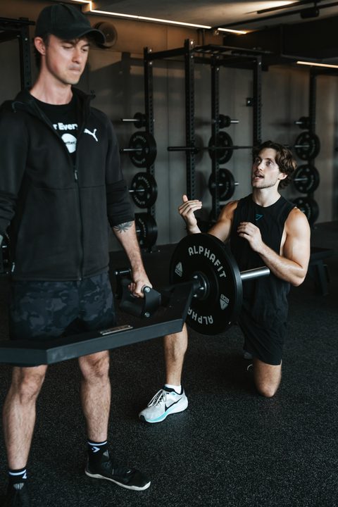 Jamie spotting a client during a lift